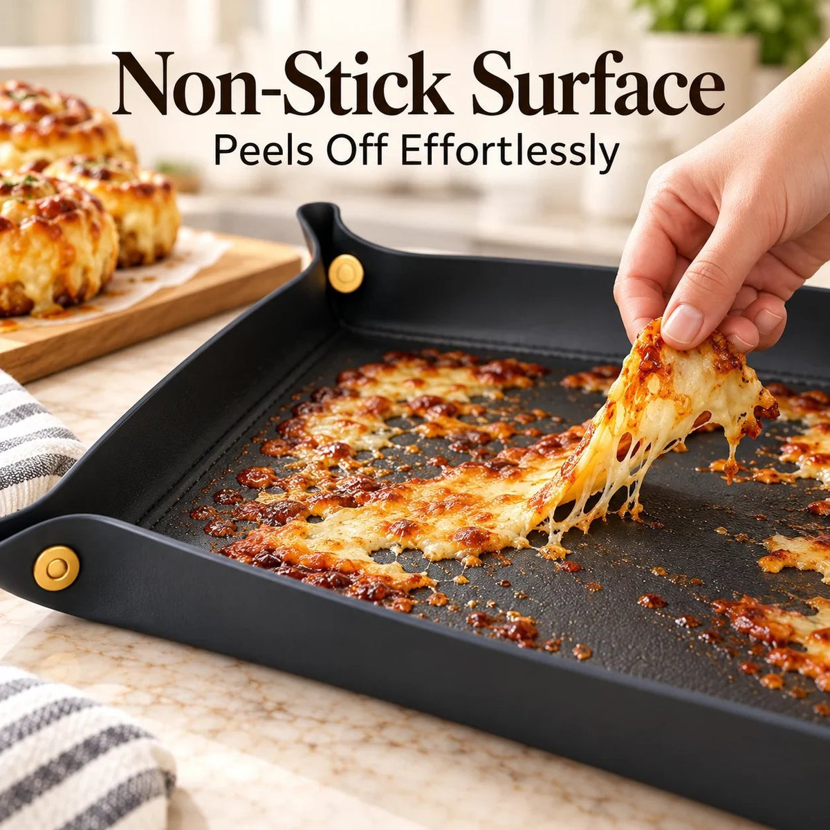 Melted baked cheese being lifted from the non-stick black silicone snap-corner baking liner